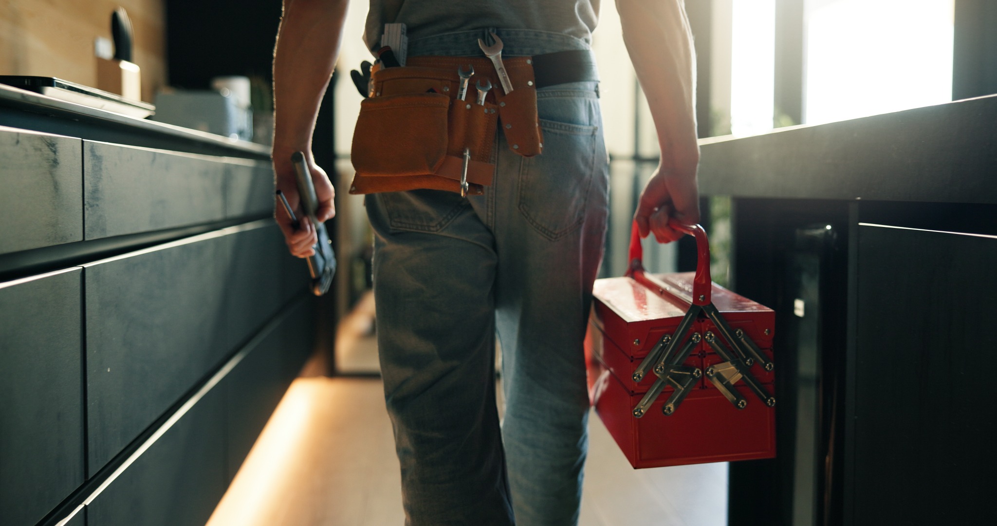 Plumbing technician performing residential service